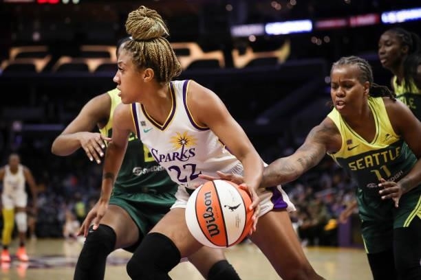 Guard Arella Guirantes of the Los Angeles Sparks gets the rebound defended by guard Epiphanny Prince of the Seattle Storm in the first half at...