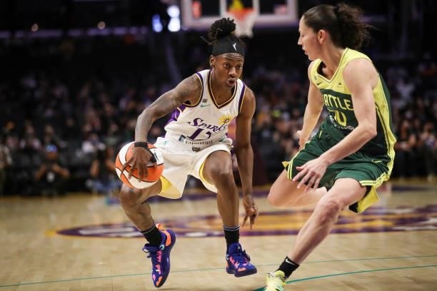 Guard Erica Wheeler of the Los Angeles Sparks handles the ball defended by guard Sue Bird of the Seattle Storm in the first half at Staples Center on...