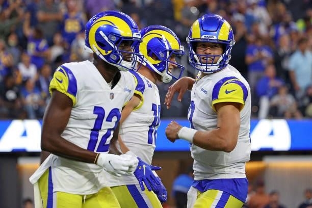 Matthew Stafford of the Los Angeles Rams celebrates a touchdown with Cooper Kupp and Van Jefferson during the second half against the Chicago Bears...