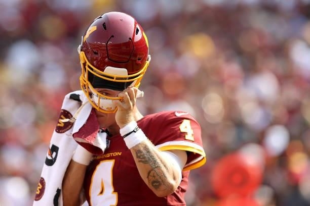 Quarterback Taylor Heinicke of the Washington Football Team during a timeout against the Los Angeles Chargers at FedExField on September 12, 2021 in...