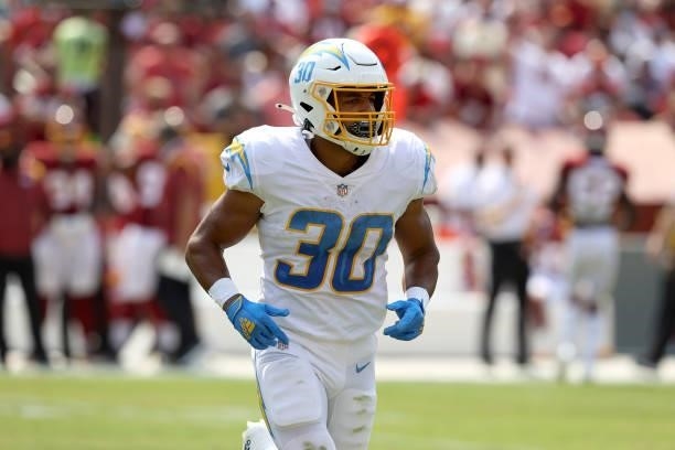 Running back Austin Ekeler of the Los Angeles Chargers runs off the field against the Washington Football Team at FedExField on September 12, 2021 in...