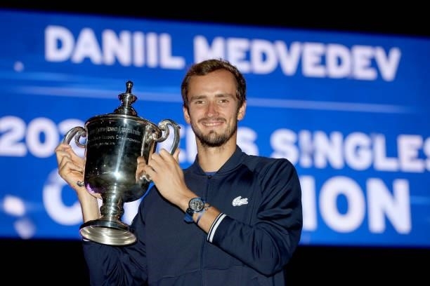 Daniil Medvedev of Russia celebrates with the championship trophy after defeating Novak Djokovic of Serbia to win the Men's Singles final match on...