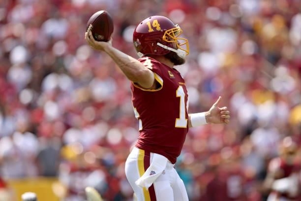 Quarterback Ryan Fitzpatrick of the Washington Football Team throws a pass against the Los Angeles Chargers at FedExField on September 12, 2021 in...