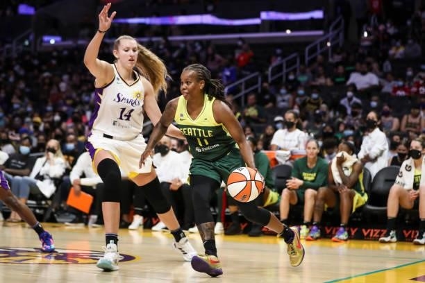 Guard Epiphanny Prince of the Seattle Storm handles the ball defended by forward Lauren Cox of the Los Angeles Sparks in the second half at Staples...