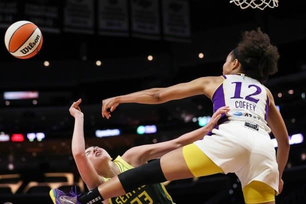 Forward Nia Coffey of the Los Angeles Sparks blocks a shot by forward Katie Lou Samuelson of the Seattle Storm in the second half at Staples Center...