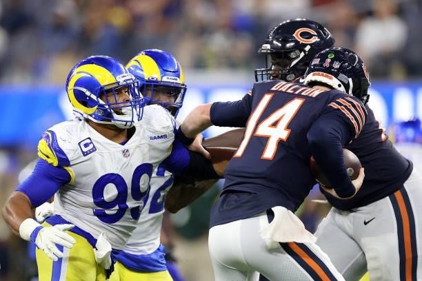 Andy Dalton of the Chicago Bears is pressured by Aaron Donald of the Los Angeles Rams during the second half at SoFi Stadium on September 12, 2021 in...