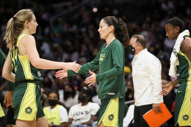 Guard Sue Bird of the Seattle Storm high-fives forward Karlie Samuelson after the game against the Los Angeles Sparks at Staples Center on September...