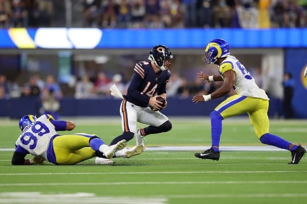 Andy Dalton of the Chicago Bears is sacked by Justin Hollins of the Los Angeles Rams during the second half at SoFi Stadium on September 12, 2021 in...