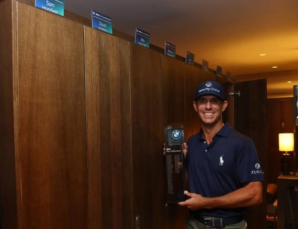 Billy Horschel of the United States of America poses with the trophy in the locker room after winning The BMW PGA Championship at Wentworth Golf Club...