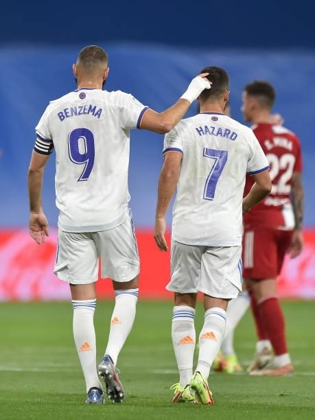Karim Benzema of Real Madrid reacts with teammate Eden Hazard of Real Madrid after scoring their team's opening goal during the La Liga Santander...