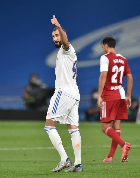 Karim Benzema of Real Madrid celebrates after scoring their team's 5th goal from the penalty spot during the La Liga Santander match between Real...