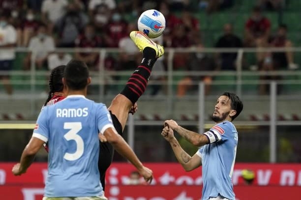 Zlatan Ibrahimovic competes for the ball with Luis Alberto of SS Lazio during the Serie A match between AC Milan and SS Lazio at Stadio Giuseppe...