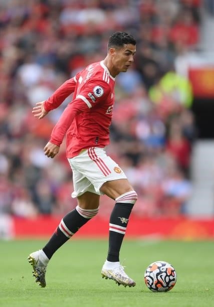 Cristiano Ronaldo runs with the ball during the Premier League match between Manchester United and Newcastle United at Old Trafford on September 11,...