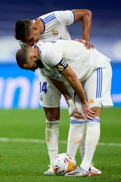 Casemiro and Karim Benzema of Real Madrid speaking before taking the penalty kick during the La Liga Santader match between Real Madrid CF and RC...