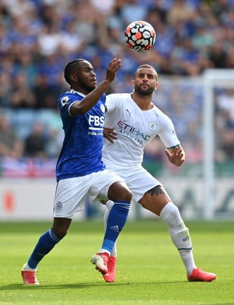Ademola Lookman of Leicester City is challenged by Kyle Walker of Manchester City during the Premier League match between Leicester City and...