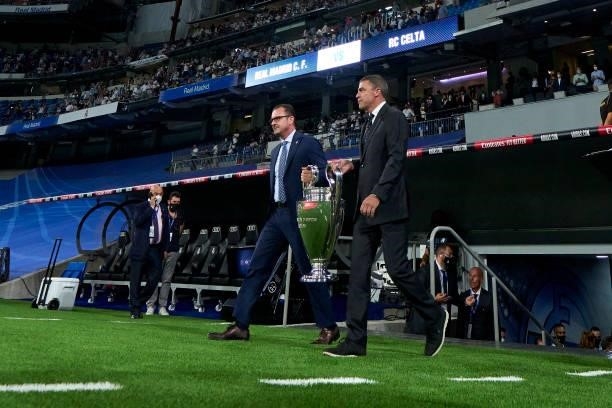 Players of Real Madrid carry the trophies that Lorenzo Sanz won as president of Real Madrid during a ceremony for former Real President Lorenzo Sanz...