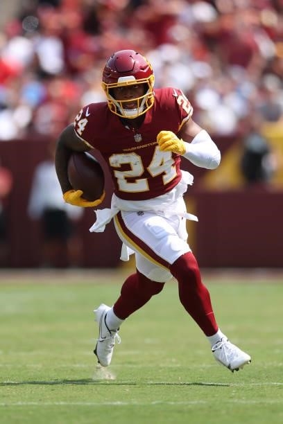 Antonio Gibson of the Washington Football Team carries the ball during the game against the Los Angeles Chargers at FedExField on September 12, 2021...