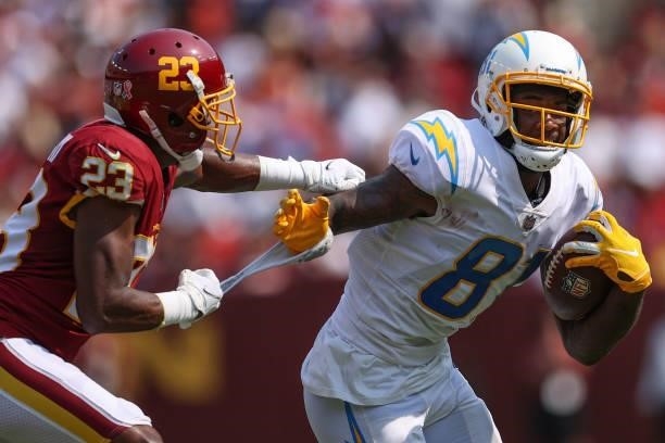 Mike Williams of the Los Angeles Chargers rushes past William Jackson of the Washington Football Team during the second quarter at FedExField on...