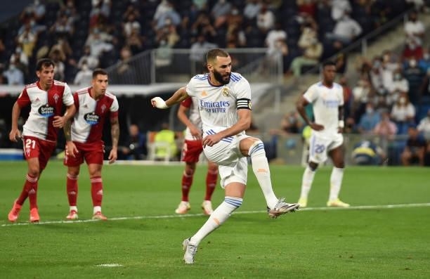Karim Benzema of Real Madrid scores their team's 5th goal from the penalty spot during the La Liga Santander match between Real Madrid CF and RC...