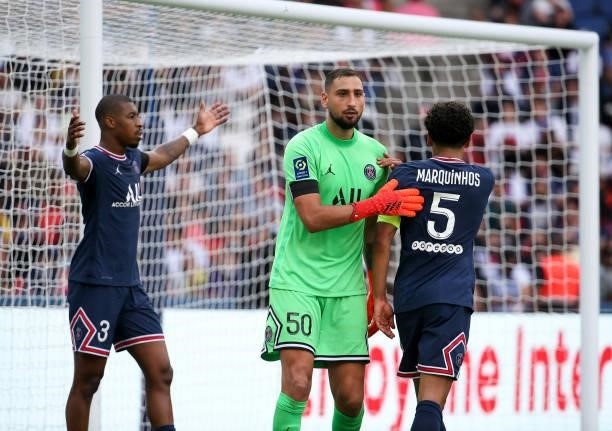 Goalkeeper of PSG Gianluigi Donnarumma between Presnel Kimpembe and Marquinhos during the Ligue 1 Uber Eats match between Paris Saint-Germain and...