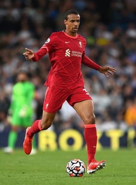 Joel Matip of Liverpool runs with the ball during the Premier League match between Leeds United and Liverpool at Elland Road on September 12, 2021 in...