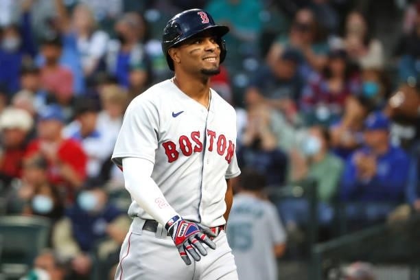 Xander Bogaerts of the Boston Red Sox reacts after striking out to end the top of the first inning against the Seattle Mariners at T-Mobile Park on...