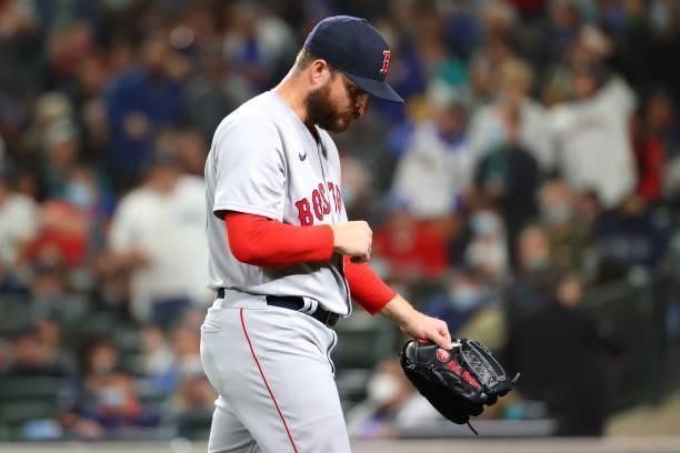 Ryan Brasier of the Boston Red Sox reacts while walking back to the dugout after being removed from the game against the Seattle Mariners in the...