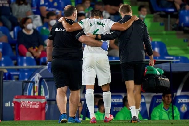 Pedro Bigas of Elche CF leaves injured the pitch during the La Liga Santander match between Getafe CF and Elche CF at Coliseum Alfonso Perez on...