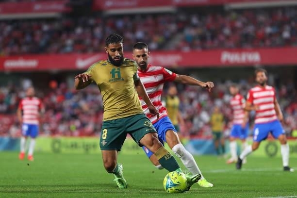Maxime Gonalons of Granada CF competes for the ball with Nabil Fekir of Real Betis during the LaLiga Santander match between Granada CF and Real...