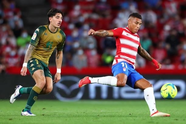 Darwin Machis of Granada CF competes for the ball with Hector Bellerin of Real Betis during the LaLiga Santander match between Granada CF and Real...