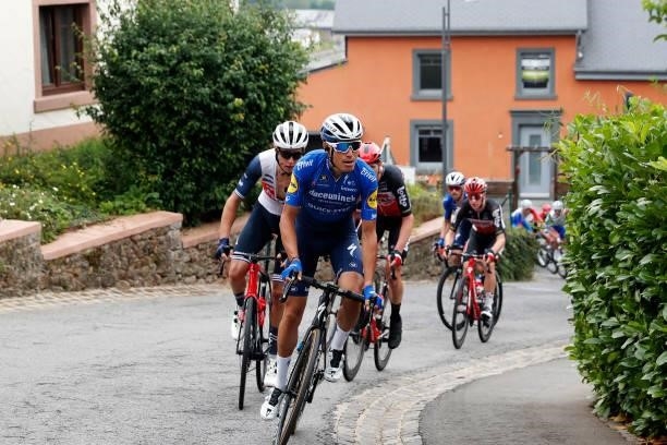 Alex Kirsch of Luxembourg and Team Trek - Segafredo and Fausto Masnada of Italy and Team Deceuninck - Quick-Step lead The Peloton during the 81st...