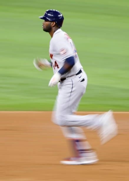 Yordan Alvarez of the Houston Astros rounds the bases after hitting a two-run home run against the Texas Rangers during the second inning at Globe...