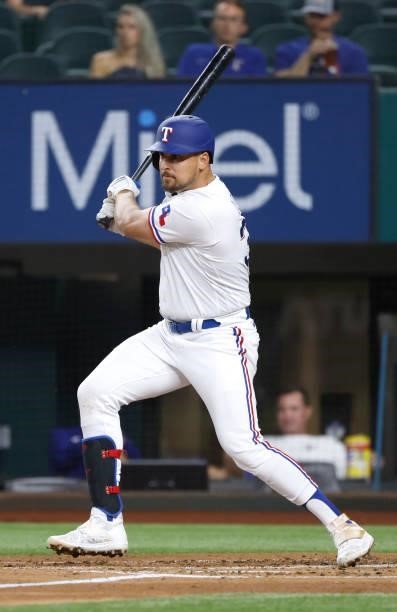 Nathaniel Lowe of the Texas Rangers singles against the Houston Astros during the first inning at Globe Life Field on September 13, 2021 in...