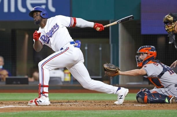 Adolis Garcia of the Texas Rangers flies out against the Houston Astros during the first inning at Globe Life Field on September 13, 2021 in...