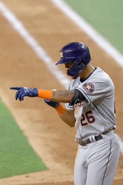 Jose Siri of the Houston Astros reacts after hitting a solo home run against the Texas Rangers during the eighth inning at Globe Life Field on...
