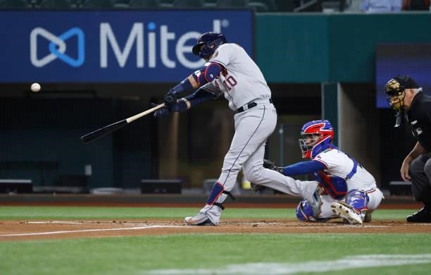 Yuli Gurriel of the Houston Astros hits a run scoring double against the Texas Rangers during the first inning at Globe Life Field on September 13,...