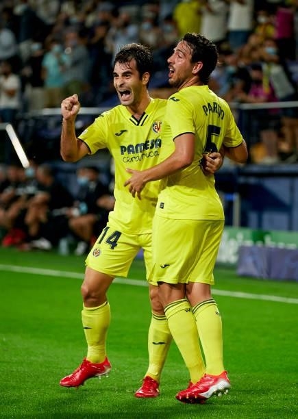 Manuel Trigueros of Villarreal celebrates after scoring his team's first goal with his teammate Daniel Parejo during the UEFA Champions League group...