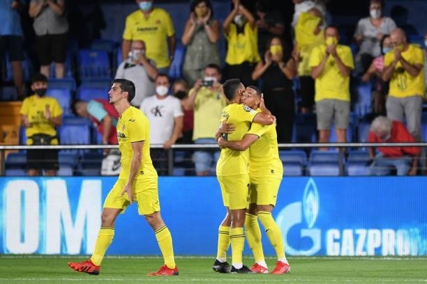 Arnaut Danjuma of Villarreal celebrates with teammate Francis Coquelin after scoring their side's second goal during the UEFA Champions League group...