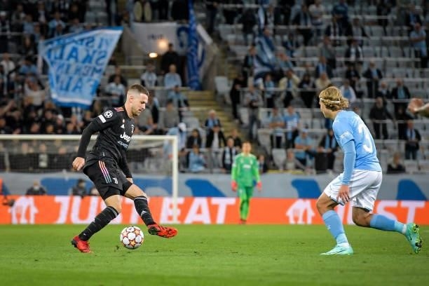 Aaron Ramsey of Juventus is challenged by Sebastian Nanasi of Malmo during the UEFA Champions League group H match between Malmo FF and Juventus at...
