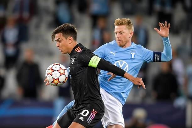 Paulo Dybala of Juventus is challenged by Anders Christiansen of Malmo during the UEFA Champions League group H match between Malmo FF and Juventus...