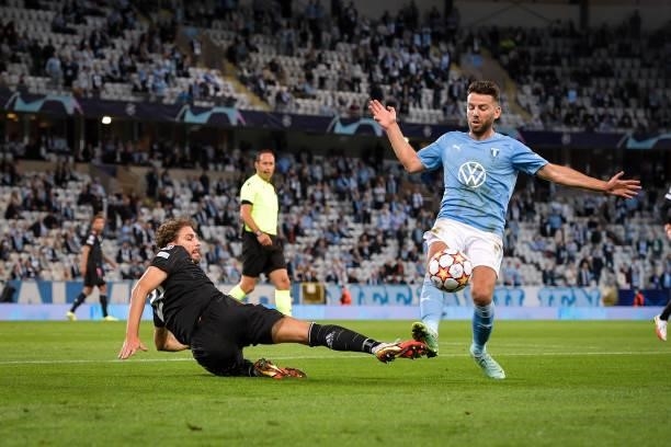 Manuel Locatelli of Juventus fights for the ball against Lasse Nielsen of Malmo during the UEFA Champions League group H match between Malmo FF and...