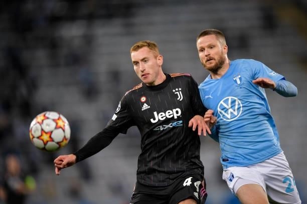 Dejan Kulusevski of Juventus fights for the ball against Lasse Nielsen of Malmo during the UEFA Champions League group H match between Malmo FF and...