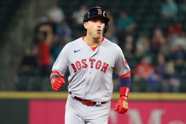 Jose Iglesias of the Boston Red Sox reacts while running the bases after hitting a solo home run against the Seattle Mariners during the third inning...