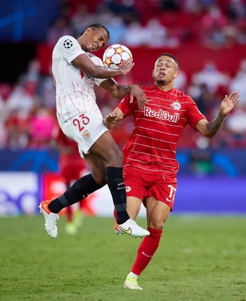 Jules Kounde of Sevilla FC competes for the ball with Brenden Aaronson of RB Salzburg during the UEFA Champions League group G match between Sevilla...
