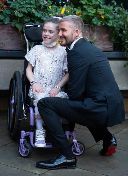David Beckham meet a young guest as he attends the Sun's Who Cares Wins Awards 2021 at The Roundhouse on September 14, 2021 in London, England.