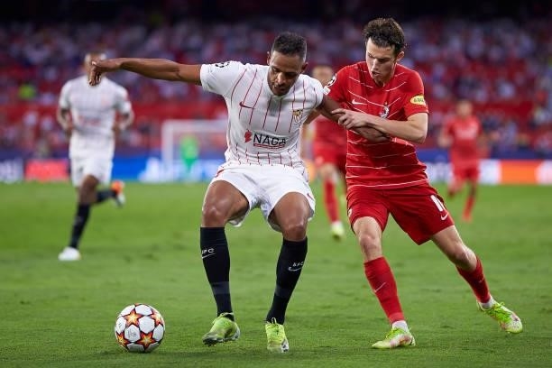 Fernando Reges of Sevilla FC competes for the ball with Brenden Aaronson of RB Salzburg during the UEFA Champions League group G match between...