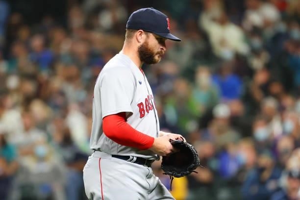 Ryan Brasier of the Boston Red Sox reacts while walking back to the dugout after being removed from the game against the Seattle Mariners in the...