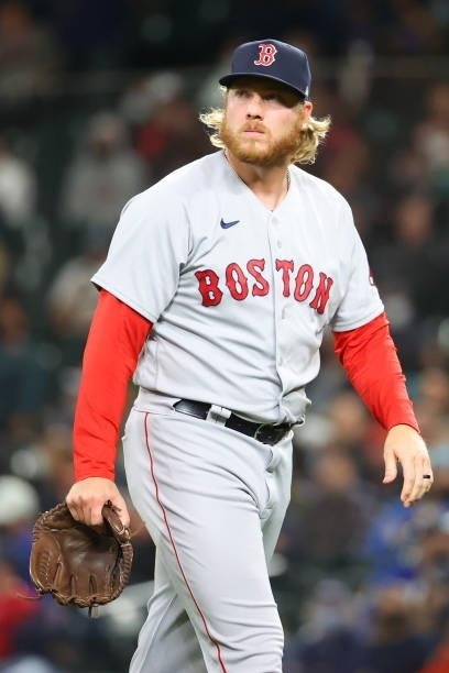 Kaleb Ort of the Boston Red Sox reacts while walking back to the dugout after being removed from the game against the Seattle Mariners in the eighth...