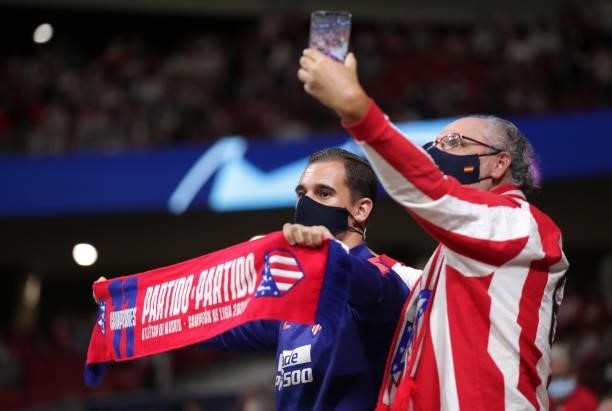 Fans of Atletico Madrid show their support during the UEFA Champions League group B match between Atletico Madrid and FC Porto at Wanda Metropolitano...