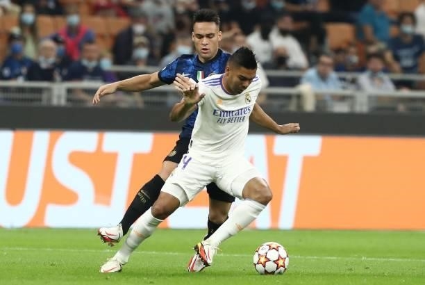 Casemiro of Real Madrid competes for the ball with Lautaro Martinez of FC Internazionale during the UEFA Champions League group D match between Inter...